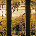 Tiffany Window Stained glass featuring an outdoor landscape of vines and hills.