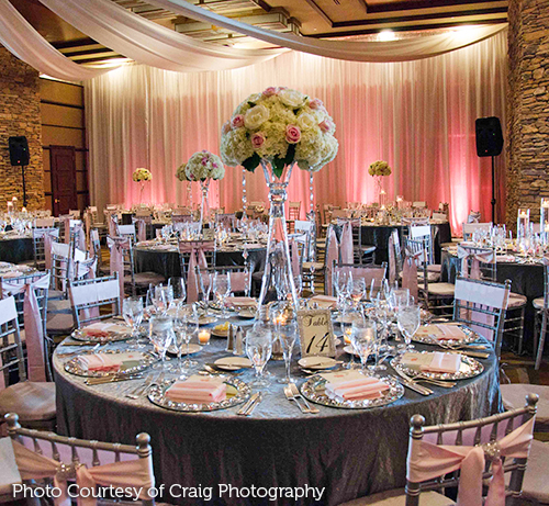 Room decorated with pink and purple drapery.