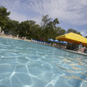 Large open pool with a swim up bar.