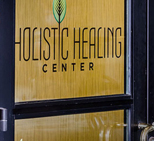 Holistic Healing Center logo on door entrance.